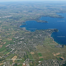 Scenic Aerial View of Lake and Surrounding Green Urban Area