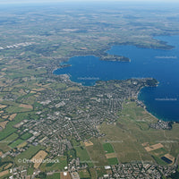 Scenic Aerial View of Lake and Surrounding Green Urban Area