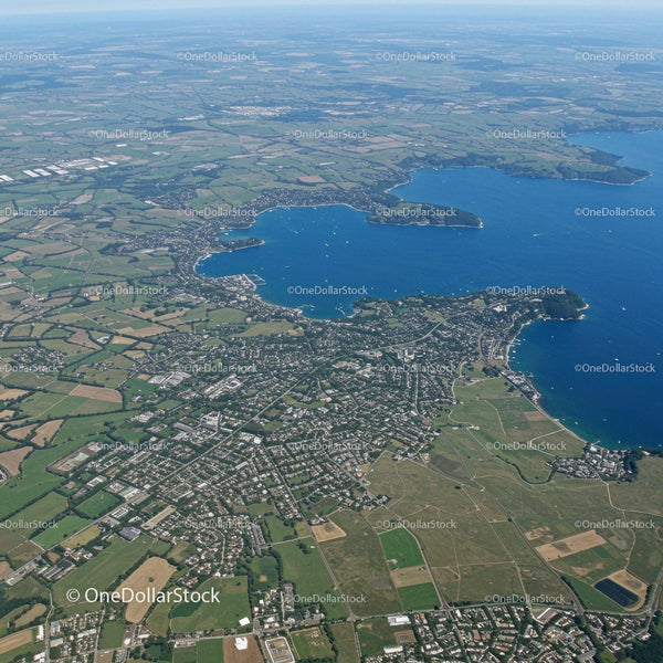Scenic Aerial View of Lake and Surrounding Green Urban Area