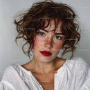 Close-Up Portrait of a Young Woman with Curly Red Hair and Freckles