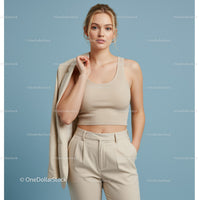 Elegant Woman in Beige Crop Top and Pants on Pastel Background
