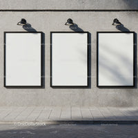 Three Blank Posters on Urban Concrete Wall with Lights