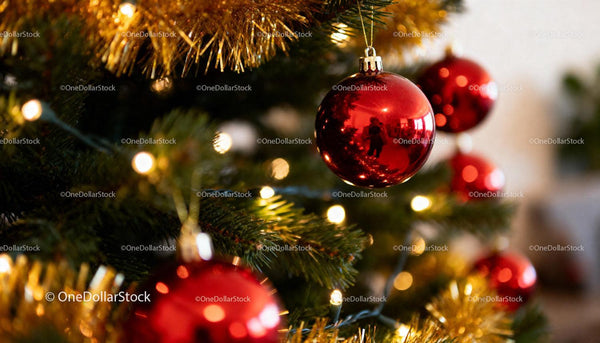 Close-up of red baubles on decorated Christmas tree