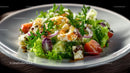 Fresh Salad with Cherry Tomatoes and Grilled Chicken on White Plate