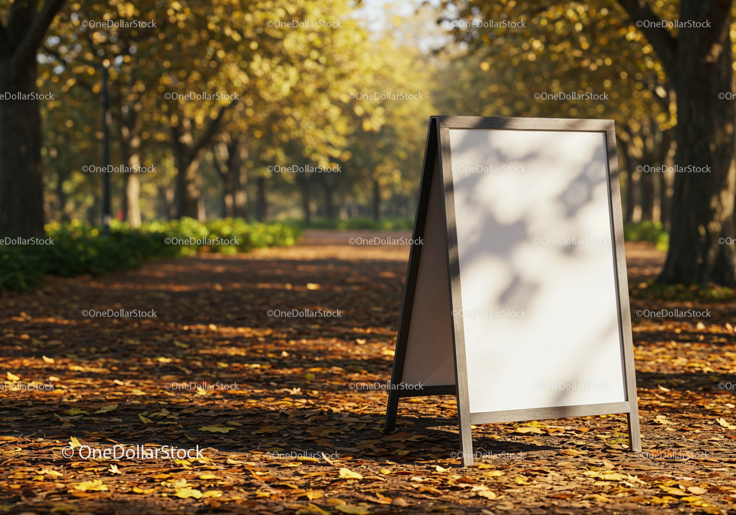 Empty sidewalk signboard in autumn park alley