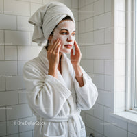 Woman Doing Facial Skincare Routine at Bathroom