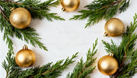 Golden Christmas ornaments with fir branches frame