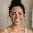 Young Woman with Freckles and Bright Smile in Natural Lighting