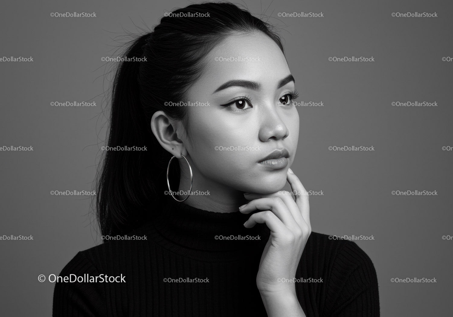 Elegant Black and White Portrait of a Woman with Earrings