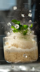 Refreshing Mint and Ice Cubes Fizz in Clear Glass