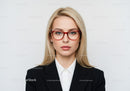 Confident Businesswoman in Black Suit and Red Glasses