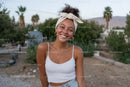 Young Woman Smiling Outdoor Portrait with Summer Fashion and Natural Setting