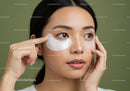 Young Woman Applying Under-Eye Patches for Skin Rejuvenation