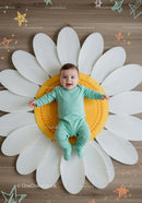 Happy Infant Relaxing on Oversized Flower Mat