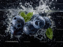 Blueberries Splash in Water with Green Mint Leaves