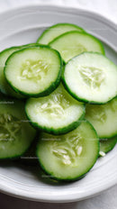 Fresh Cucumber Slices in a White Bowl for Healthy Eating and Refreshing Snacking