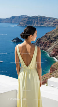 Woman in Elegant Dress Enjoying Scenic Coastal View