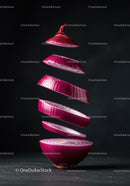 Floating Slices of Red Onion in Dark Setting