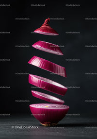 Floating Slices of Red Onion in Dark Setting