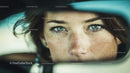 Close-up of Freckled Woman with Piercing Blue Eyes Wearing Stylish Hat