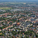 Aerial View of Cityscape with Red Roofs and Green Parks