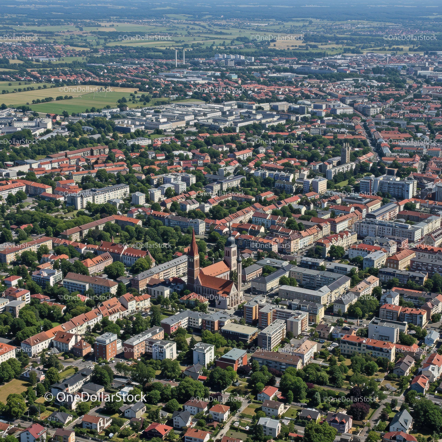 Aerial View of Cityscape with Red Roofs and Green Parks