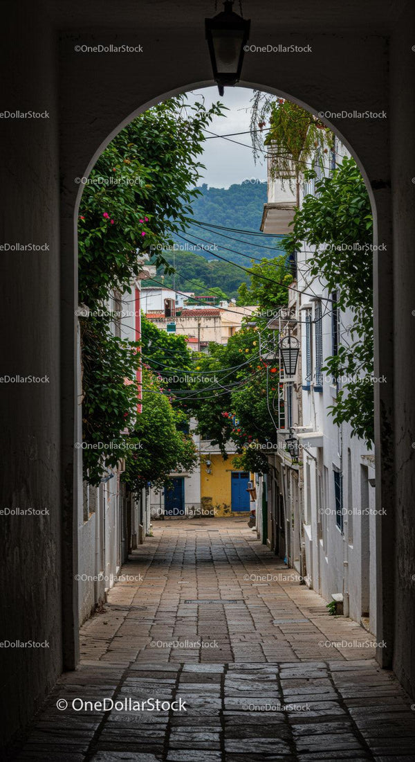 Colorful Colonial Archway Over Cobblestone Street with Mountain View