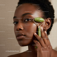 Elegant African Woman Using Jade Roller for Facial Skincare
