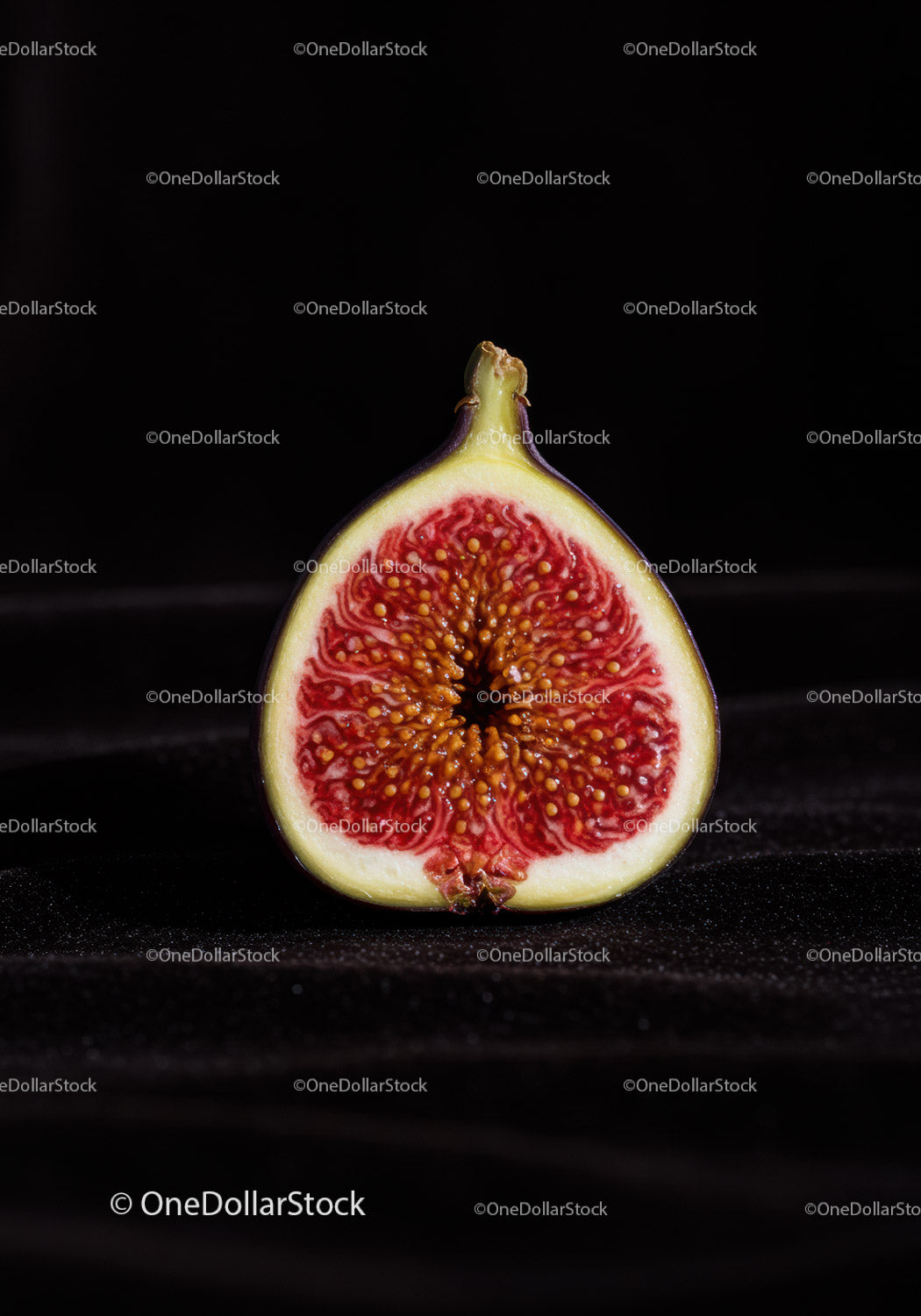 Close Up of Fresh Halved Fig on Black Background