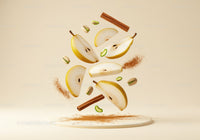 Fresh pear slices with cinnamon and pistachios floating