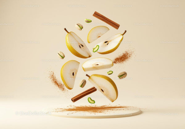 Fresh pear slices with cinnamon and pistachios floating