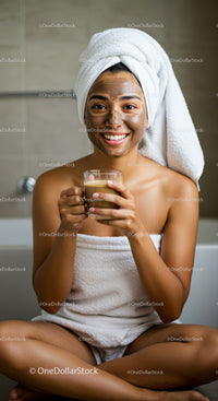 Smiling Woman with Facial Mask Holding Glass of Tea in Bathroom
