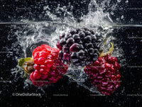 Fresh Black Raspberries Splashing into Water Showing Juicy Fruits