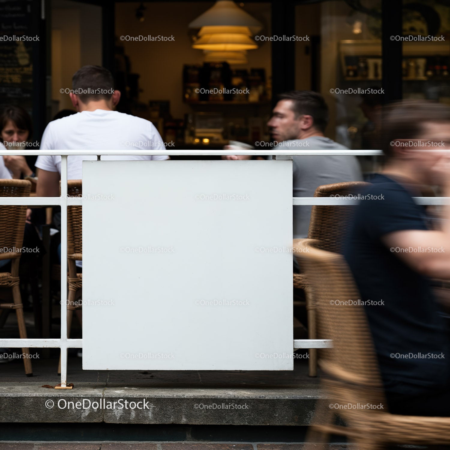 Busy outdoor cafe scene with people in motion