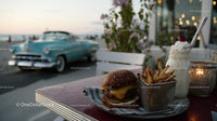 Beachside Casual Outdoor Dining Scene with Burger Fries and Milkshake