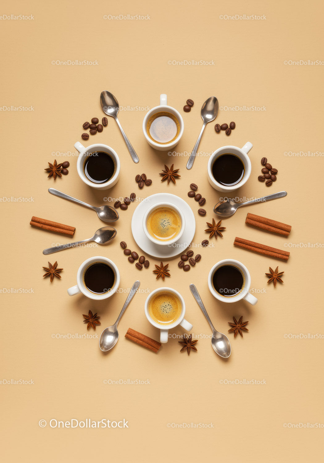 Assorted coffee cups with spices and spoons on beige