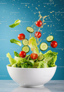 Fresh Salad Ingredients Splashing in White Bowl