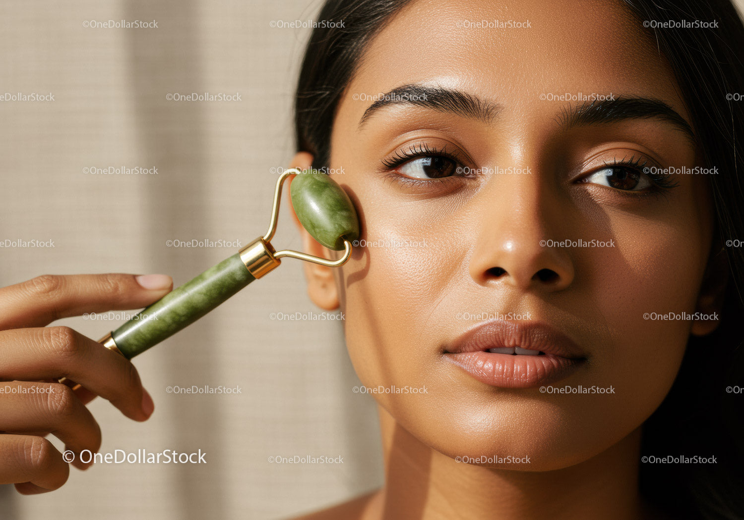 Woman Using Jade Roller for Facial Massage and Skincare