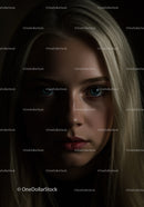 Moody portrait of blonde woman with intense gaze