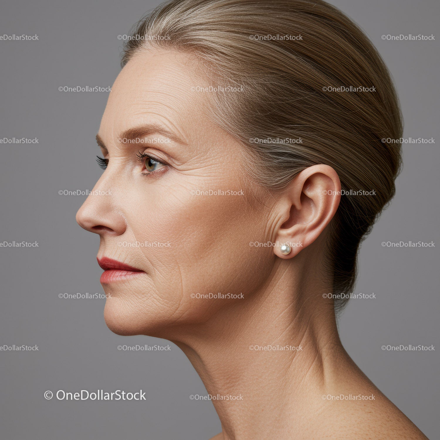 Elegant Mature Woman Profile with Pearl Earrings and Stylish Hair