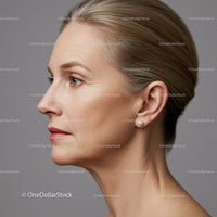 Elegant Mature Woman Profile with Pearl Earrings and Stylish Hair