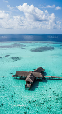 Overwater Bungalow in Crystal Clear Turquoise Ocean Under Blue Sky