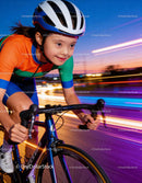 Determined Girl Cycling Fast at Dusk