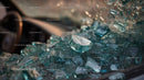 Abandoned Vintage Car with Broken Glass at Sunset