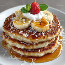 Banana Pancakes with Strawberries and Caramel Syrup