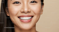 Close up of smiling young woman with healthy skin