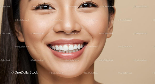Close up of smiling young woman with healthy skin