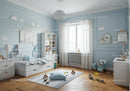 Bright Children's Bedroom with Baby Bed and Playful Toys