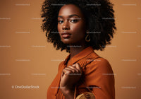 Elegant Black Woman with Curly Hair in Stylish Orange Blouse for Fashion Portrait
