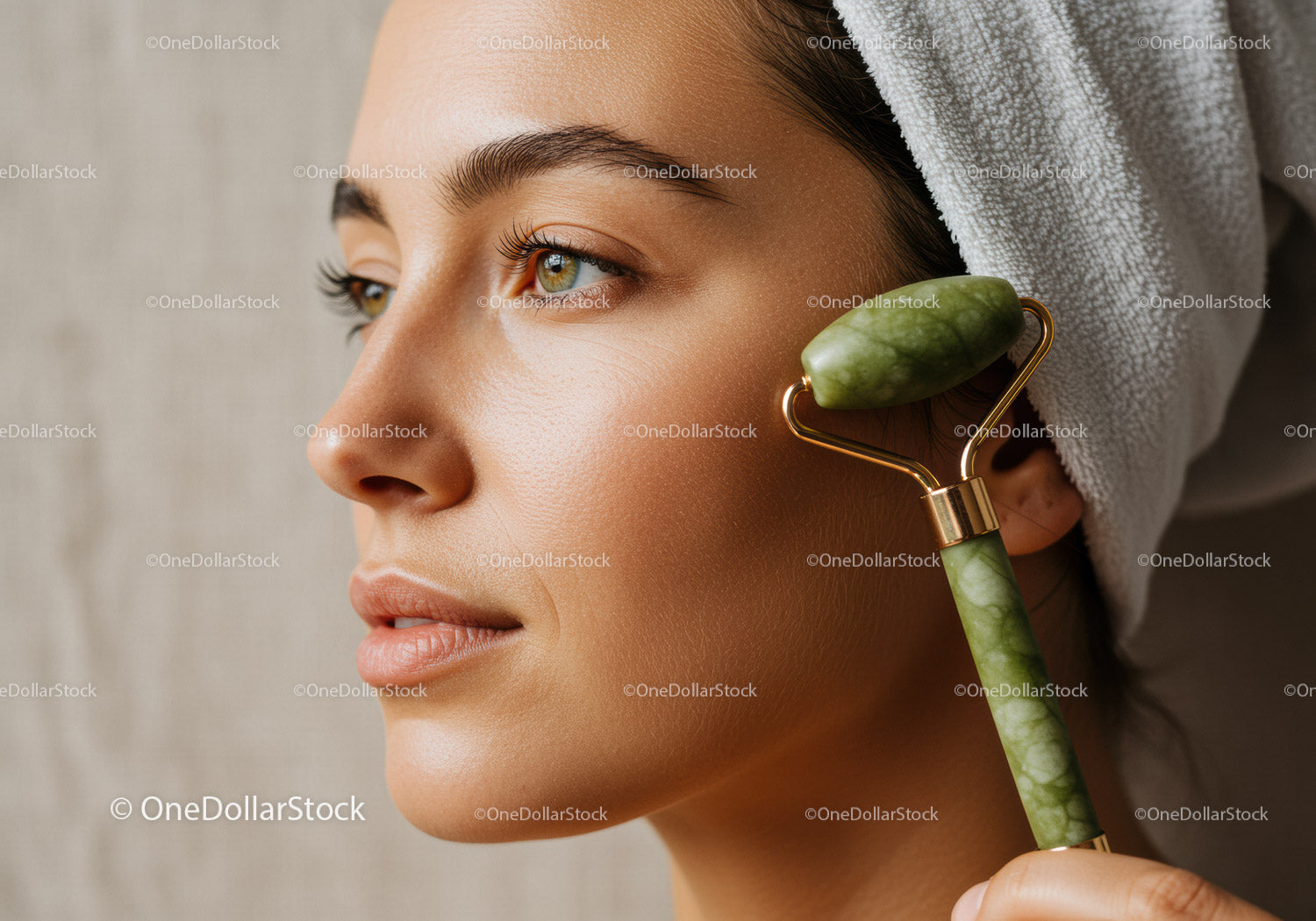 Close-Up of Woman Using Jade Roller for Skin Rejuvenation and Facial Massage